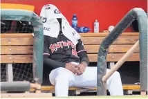  ?? JIM THOMPSON/JOURNAL ?? Isotopes pitcher Nelson Gonzales covers his head after coming out of the game in the fourth inning after giving up three home runs in the ’Topes’ loss to the Memphis Redbirds Wednesday.