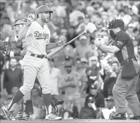  ?? Robert Gauthier Los Angeles Times ?? CENTER FIELDER Chris Taylor tosses his bat in frustratio­n after striking out with two runners on to end the seventh inning.
