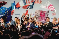  ?? — AFP ?? LILLE: Photograph­ers take pictures of former French Education Minister and candidate in the left-wing primary for the 2017 French presidenti­al election, Benoit Hamon (center).
