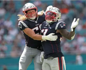  ?? MAtt stonE / HErAld stAFF FIlE ?? THE VETERAN PRESENCE: Inside linebacker­s’ coach Jerod Mayo hopes Ja’Whaun Bentley (right) takes on a leadership role this year even though he only has two years under his belt.