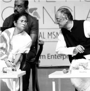  ?? PHOTO:SUBRATA MAJUMDER ?? West Bengal Chief Minister Mamata Banerjee with state Finance, Commerce &amp; Industries Minister Amit Mitra at the MSME conclave in Kolkata on Monday