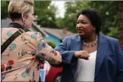  ?? BRYNN ANDERSON — THE ASSOCIATED PRESS FILE ?? Georgia Democratic gubernator­ial candidate Stacey Abrams greets a supporter May 24in Atlanta.