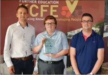  ??  ?? Brian O’Shea (left) and Alan Johnson (right) pictured presenting Bryan O’Shea with his Software Developmen­t award at the KCFE awards night last Thursday.