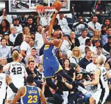  ?? AP ?? Golden State Warriors forward Kevin Durant scores during the first half in Game 3 of the NBA Western Conference finals in San Antonio on Saturday.