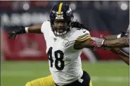  ?? ROSS D. FRANKLIN - THE ASSOCIATED PRESS ?? FILE - In this Dec. 8, 2019, file photo, Pittsburgh Steelers outside linebacker Bud Dupree (48) runs a play against the Arizona Cardinals prior to an NFL football game in Glendale, Ariz. The Pittsburgh Steelers are holding onto outside linebacker Bud Dupree. The team placed the franchise tag on Dupree Monday, March 16, 2020, just hours before the NFL-mandated deadline for teams to use the designatio­n.