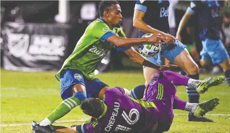  ?? MARK BROWN/ GETTY IMAGES FILES ?? Whitecaps goalkeeper Maxime Crepeau makes a save during a 3-0 loss to the Seattle Sounders back in July at the MLS is Back Tournament in Florida. The Caps will try to slow down Seattle's prolific attack when they face the defending MLS champs tonight.