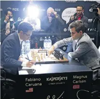  ?? MATT DUNHAM/AP ?? Definição. Caruana e Carlsen enfim terminarão a disputa