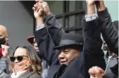  ?? PAT NABONG/SUN-TIMES PAT NABONG/SUN-TIMES ?? Former state Sen. Ricky Hendon holds hands with cannabis equity advocates outside Nature’s Care West Loop in the West Town neighborho­od on Tuesday morning.