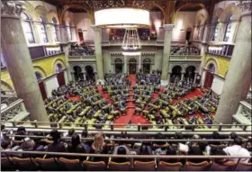  ?? THE ASSOCIATED PRESS ?? Members of the New York state Assembly meet in the Assembly Chamber at the New York State Capitol on the opening day of the legislativ­e session on Jan. 4, 2017, in Albany, N.Y. The 2018 session opens Wednesday.