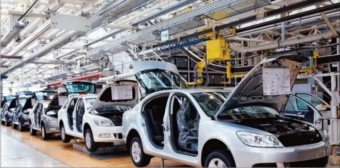  ??  ?? Cars assembled at a local assembly plant in Nigeria. By Sulaimon Salau and Benjamin Alade