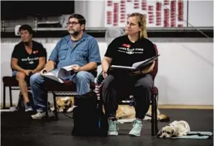  ?? SARAH ESPEDIDO/ORLANDO SENTINEL ?? Teri Pleinis, right, takes notes during a December class at K9 Partners for Patriots.