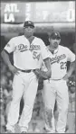  ?? Robert Gauthier L. A. Times ?? RONALD BELISARIO, left, waits for Dodgers Manager Don Mattingly to remove him from the game against Atlanta.