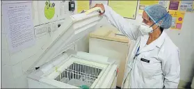  ??  ?? A medic shows the freezer meant for keeping the Covid vaccines, in Jaipur.