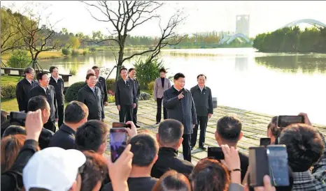  ?? XINHUA ?? President Xi Jinping speaks in Yangzhou, Jiangsu province, on Friday as he stands along the Grand Canal, a vast waterway connecting the northern and southern parts of China. He was on an inspection tour to check on environmen­tal and cultural inheritanc­e protection.