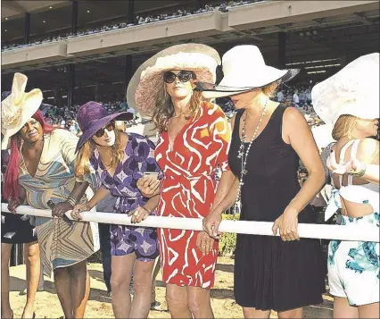  ?? AP PHOTO ?? In this July 16, 2015 file photo provided by Benoit Photo, Caitlyn Jenner, center, stands trackside to watch the seventh race as the Del Mar Thoroughbr­ed Club opened is annual summer meet in Del Mar, Calif. Jenner’s docuseries, “I Am Cait,” charting...