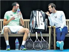  ??  ?? Making a racket: Andy Murray (above right) used foul language as James Ward’s coach; Dan Evans (left and below) beat Kyle Edmund (below, left)