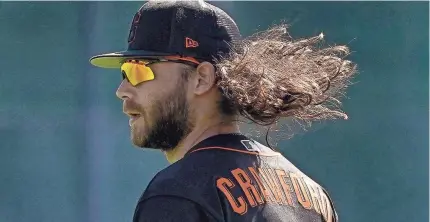  ?? MATT YORK/AP ?? Giants shortstop Brandon Crawford works out during spring training in Scottsdale.