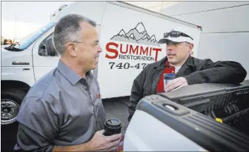  ?? JEFF SCHEID/LAS ?? Ken Bagwell, left, general manager of Everest Constructi­on LLC, and Will Dellaechai­e, president of Summit Restoratio­n Inc. and managing member of Everest Constructi­on, discuss a project. Bagwell said he’s noticed people deciding to “loosen up” their...