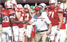  ?? BRUCE THORSON, USA TODAY SPORTS ?? Nebraska coach Mike Riley, center, heads into the offseason focused on player developmen­t.