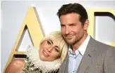  ?? NEIL HALL/ EPA-EFE ?? TERBAWA FILM: Lady Gaga dan Bradley Cooper saat promo A Star is Born. Chemistry mereka sangat kuat di film ini.