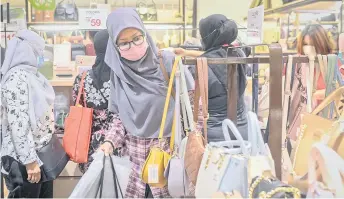  ?? — Bernama photo ?? Consumer spending in Malaysia is expected to remain strong despite the earlier-than-expected OPR hike recently, analysts say.