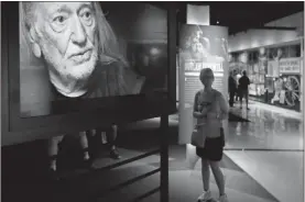  ?? / AP-Mark Humphrey ?? A video featuring Willie Nelson plays in the Outlaws & Armadillos exhibit at the Country Music Hall of Fame and Museum in Nashville, Tenn.