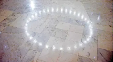  ??  ?? Lights in the rotunda reflect on the marble floor Thursday at the state Capitol in Oklahoman City.