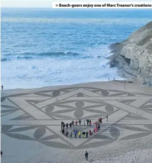  ??  ?? > Beach-goers enjoy one of Marc Treanor’s creations