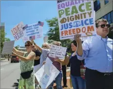  ?? MIKE MOORE/THE JOURNAL-GAZETTE VIA AP ?? People line up to protest U.S. Attorney General Jeff Sessions and immigratio­n reform at Parkview Field in Fort Wayne, Ind. on Thursday.