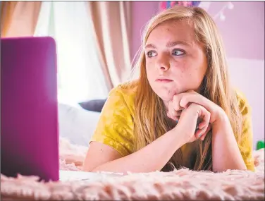  ?? Associated Press ?? Above, Elsie Fisher in “Eighth Grade” and, below, in a scene with Emily Robinson, left.