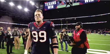  ?? CHRISTIAN PETERSEN / GETTY ?? J.J. Watt walks off the field following his team’s 22-19 win over the Buffalo Bills in the AFC Wild Card Playoff game in January.