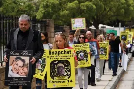  ?? Patrick T Fallon/AFP/Getty Images ?? Steve Filson, left, whose daughter Jessica died of fentanyl poisoning, and Amy Neville, right, whose son Alexander died, march outside the Snap headquarte­rs in June 2021. Photograph: