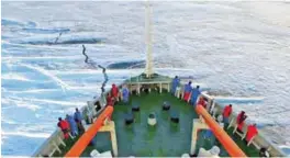 ??  ?? ANTARCTICA: In this file photo, members of the Chinese Antarctica Research Team wait for the arrival at the continent on board of the polar expedition ship Xuelong.