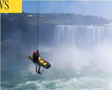  ?? HARRY ROSSETANI / THE ASSOCIATED PRESS FILES ?? Niagara Falls emergency officials rescue a man who plunged over Niagara Falls and survived in 2012. The man is only the third person known to have lived after going over the falls without a safety device.