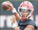  ?? Via AP, File / Joshua L. Jones-Athens Banner-Herald ?? Georgia quarterbac­k Justin Fields looks to throw a pass during NCAA college football practice in Athens.