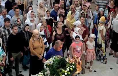  ?? File photo ?? People taking part in the second Christmas Mass at the Russian Orthodox Church in Sharjah last year. —