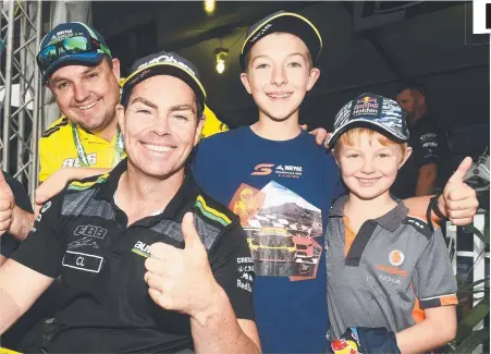  ?? Picture: ZAK SIMMONDS ?? FAREWELL: Stuart Raison with sons Sam, 7, and Wil Raison, 11, and Craig Lowndes who shocked fans by announcing his retirement from full- time racing yesterday.