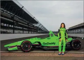  ?? THE ASSOCIATED PRESS ?? In this Monday photo provided by GoDaddy Operating Company, LLC., Danica Patrick poses with her race car at Indianapol­is Motor Speedway in Indianapol­is, Ind. Danica Patrick returned to Indianapol­is Motor Speedway this week expecting to drive an Indy...