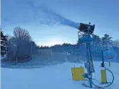  ?? AP PHOTO/NICK PERRY ?? A snow machine at Gunstock Mountain Resort billows snow Thursday in Gilford, N.H.