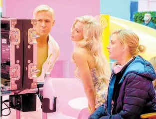  ?? AP PHOTOS ?? This image released by Warner Bros. Pictures shows (from left) actors Ryan Gosling and Margot Robbie, with director Greta Gerwig on the set of ‘Barbie’.
