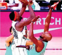  ?? AP ?? Toronto Raptors’ Pascal Siakam, front left, shoots over Memphis Grizzlies’ Anthony Tolliver, right, during the second quarter of an NBA basketball game Sunday, Aug. 9, 2020, in Lake Buena Vista, Florida.