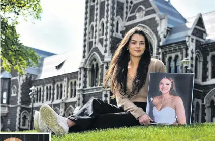  ?? PHOTOS: CHRISTINE O’CONNOR ?? A place to reflect . . . Megan Prentice says she is glad there will soon be a space at the University of Otago where people can come together to honour the memory of her friend, Sophia Crestani, whose picture she holds. Left: A memorial bench for Miss Crestani.