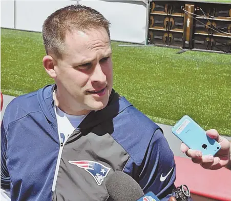  ?? STAFF PHOTO BY PATRICK WHITTEMORE ?? NO OFFENSE TAKEN: Josh McDaniels met with the media yesterday in Foxboro and said he didn’t have an issue with Tom Brady missing the Patriots’ voluntary preseason workouts.