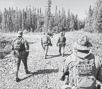  ?? THE CANADIAN PRESS ?? In this photo posted to Twitter on July 30, RCMP search an area near Gillam, Man., for Bryer Schmegelsk­y and Kam McLeod. The bodies of Schmegelsk­y and McLeod were found in northern Manitoba on Wednesday.