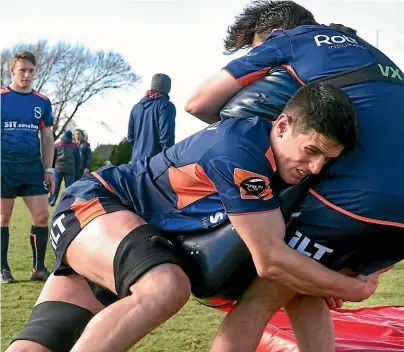  ??  ?? Ben Fotheringh­am tackles Flynn Thomas during a Stags training session at Surrey Park, Invercargi­ll, yesterday. JOHN HAWKINS/STUFF