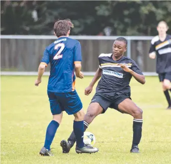  ??  ?? CLOSE CONTROL: Hawks’ Brayden Lobwein (left) looks to play the ball around West Wanderers defender Premice Kalenga during their TFL Conference Men’s division clash.