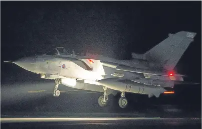  ??  ?? A RAF Tornado comes in to land at RAF Akrotiri after the controlled air strike on Syrian installati­ons on April 14. Correspond­ents question the UK’s justificat­ion for the strikes.