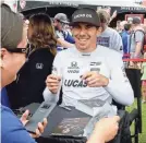  ?? GARY C. KLEIN / USA TODAY NETWORK-WISCONSIN ?? IndyCar driver Robert Wickens meets with fans during an autograph session Friday at Road America.