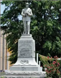  ?? Jay Reeves/AP ?? Monument: A Confederat­e monument dedicated in 1909 stands in the middle of the square in Tuskegee, Ala., on Thursday, June 28, 2018. Demonstrat­ors once tried to topple the monument and it has been the target of vandals. Yet a Confederat­e heritage group owns the land, and the memorial has survived generation­s in a mostly black city known as a landmark of minority education and empowermen­t. Black graffiti from a vandalism incident that occurred last year is still visible on the base.