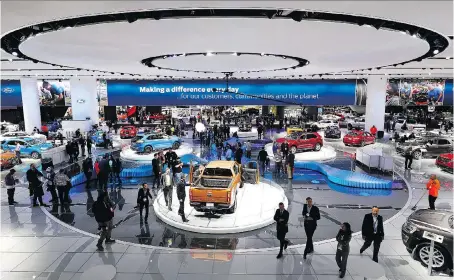  ?? BILL PUGLIANO/ GETTY IMAGES ?? The Ford exhibit at the 2018 North American Internatio­nal Auto Show in Detroit has dozens of models on display. The show — the largest of its kind on the continent — opens to the public Saturday and runs until Jan. 28.